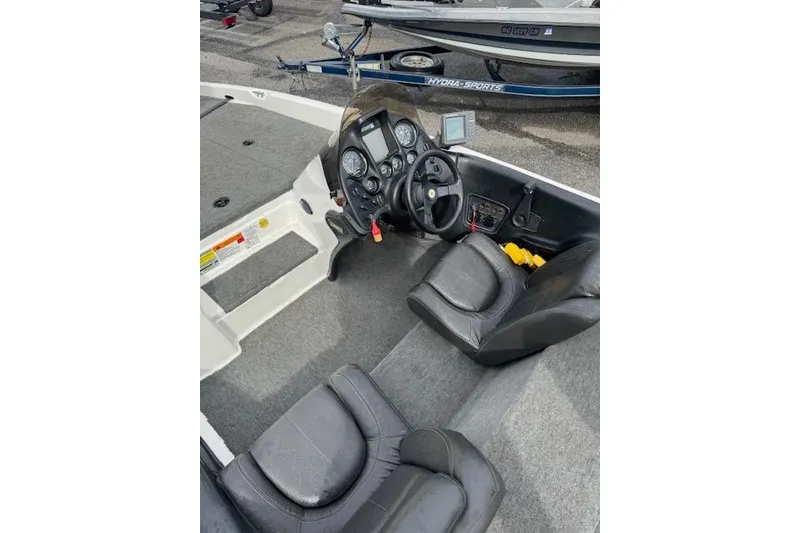 Slide: The Image of 2001 Stratos 19SS Extreme boat interior with steering console and seating. - 8