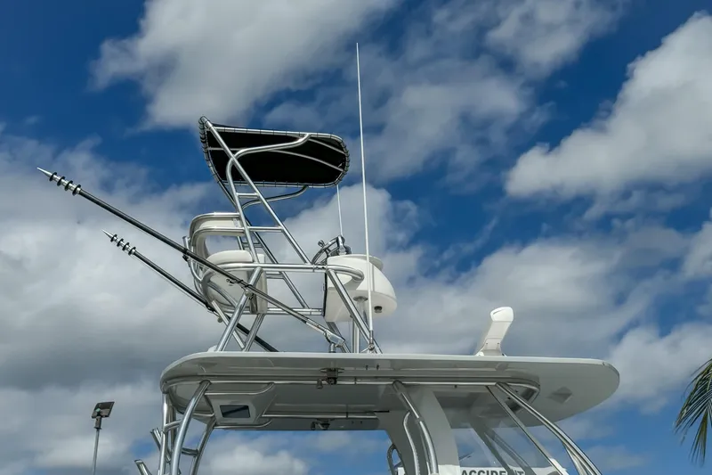 Slide: The Image of 2023 Front Runner 36 Center Console boat tower against a cloudy blue sky. - 1