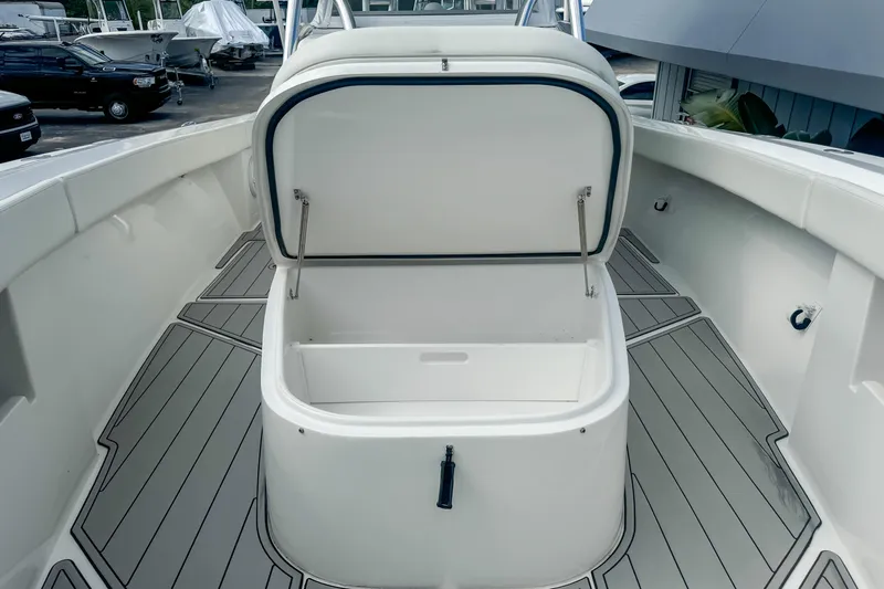 Slide: The Image of 2023 Front Runner 36 Center Console boat with open storage compartment on deck. - 10
