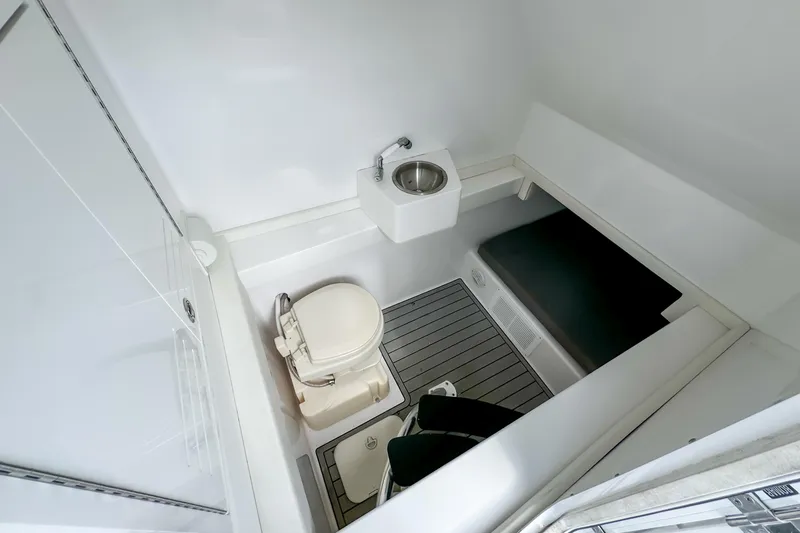 Slide: The Image of 2023 Front Runner 36 Center Console boat interior with toilet and sink. - 13