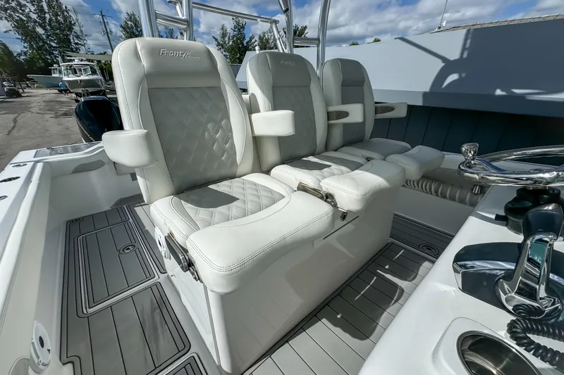 Slide: The Image of 2023 Front Runner 36 Center Console boat with luxurious white seating and modern design. - 19