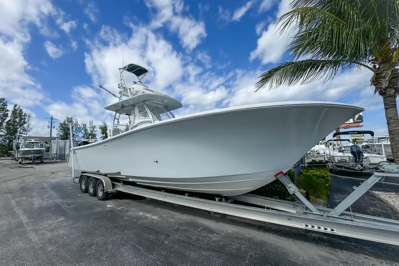 Slide: The Image of 2023 Front Runner 36 Center Console boat on trailer under blue sky. - 2