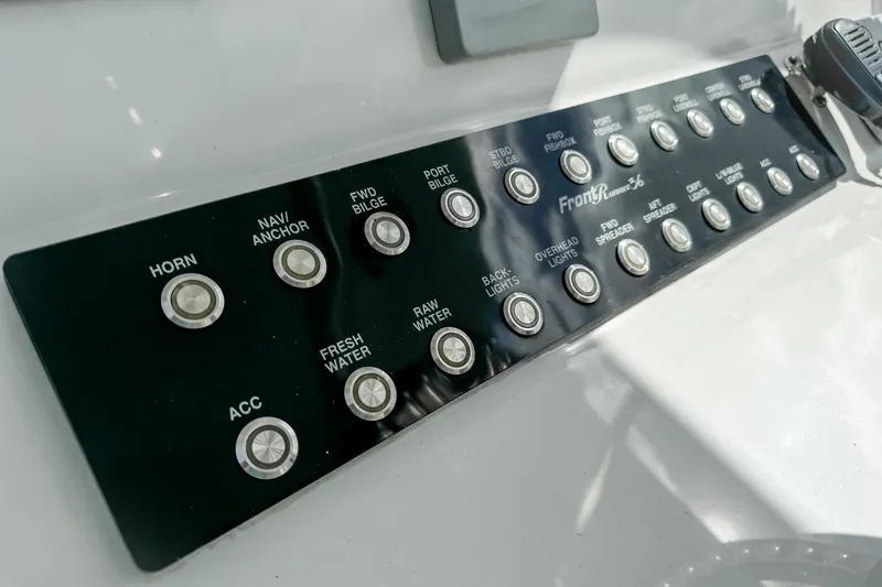 Slide: The Image of Control panel of 2023 Front Runner 36 Center Console boat with labeled buttons. - 23