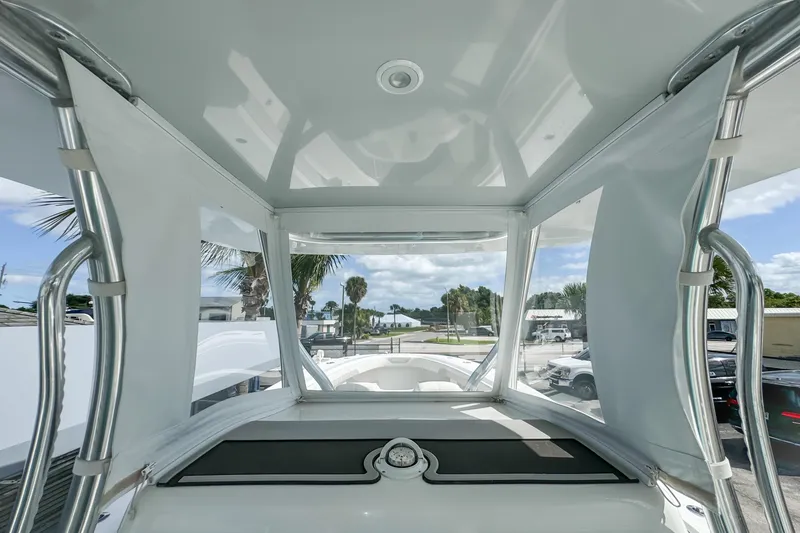 Slide: The Image of 2023 Front Runner 36 Center Console boat interior with clear canopy and sleek design. - 24