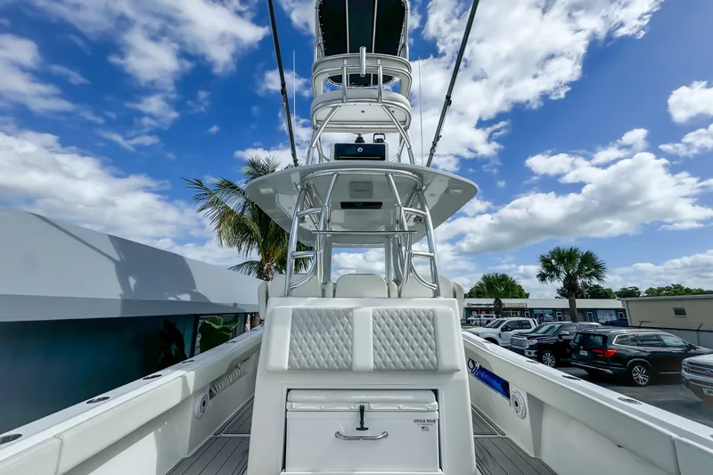 Slide: The Image of 2023 Front Runner 36 Center Console boat with tower, parked under a blue sky. - 29