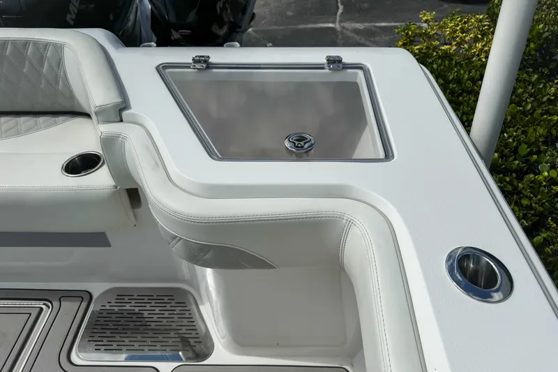 Slide: The Image of 2023 Front Runner 36 Center Console boat interior with seating and storage compartment. - 33