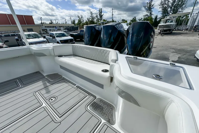 Slide: The Image of 2023 Front Runner 36 Center Console boat with triple Mercury engines and sleek interior design. - 34