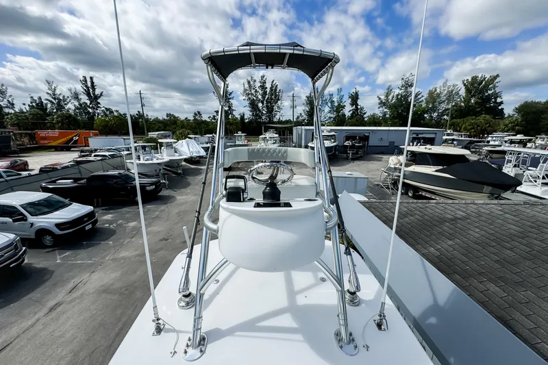 Slide: The Image of 2023 Front Runner 36 Center Console boat in a marina with cloudy sky. - 35