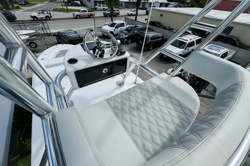 Slide: The Image of 2023 Front Runner 36 Center Console helm with luxurious seating and steering wheel. - 36