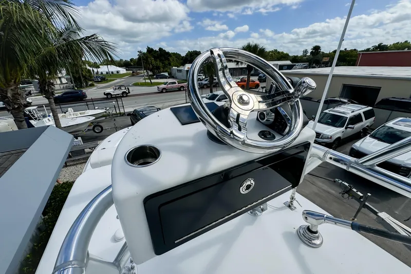 Slide: The Image of 2023 Front Runner 36 Center Console boat helm with chrome steering wheel. - 37
