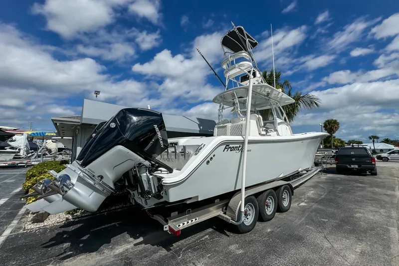 Slide: The Image of 2023 Front Runner 36 Center Console boat on trailer under blue sky. - 4