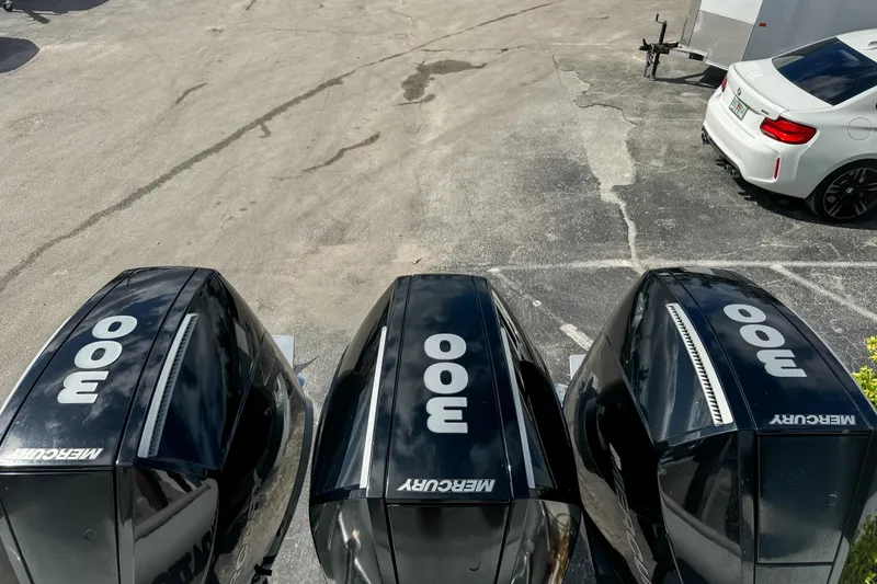 Slide: The Image of Triple Mercury 300 outboard engines on a 2023 Front Runner 36 Center Console boat. - 6