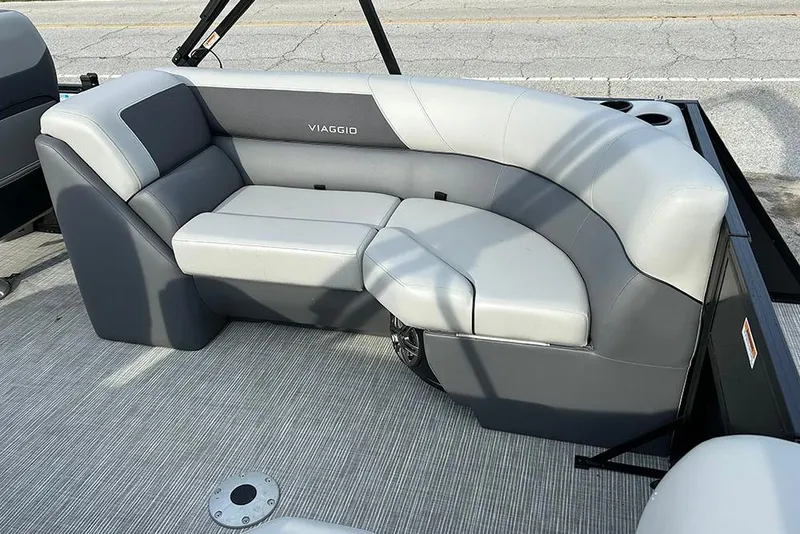 Slide: The Image of 2025 Viaggio Lago V-U boat seating with gray upholstery and cup holders. - 12