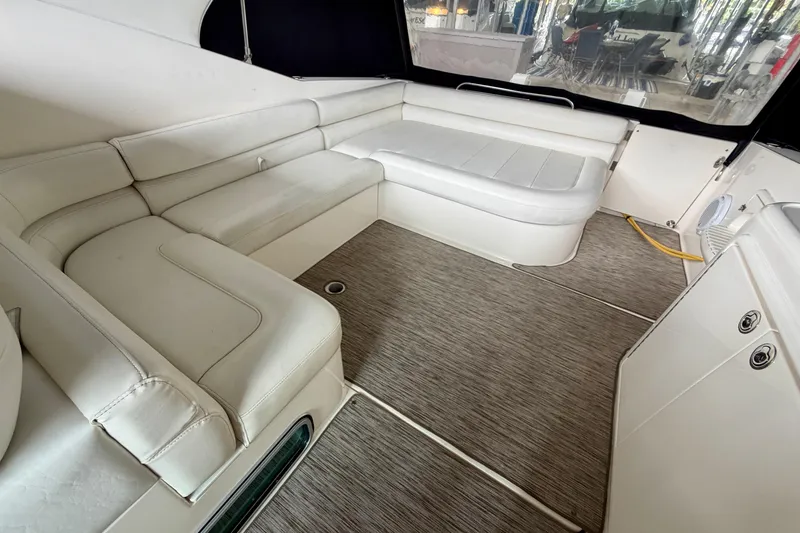 Slide: The Image of Interior of 1999 Wellcraft 45 Excalibur boat with TV, cabinets, and sink. - 11