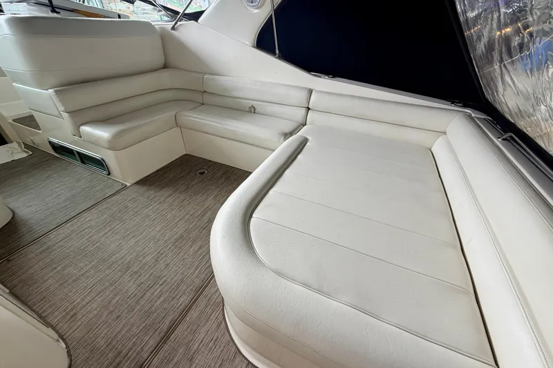 Slide: The Image of 1999 Wellcraft 45 Excalibur interior with white seating and modern design. - 14