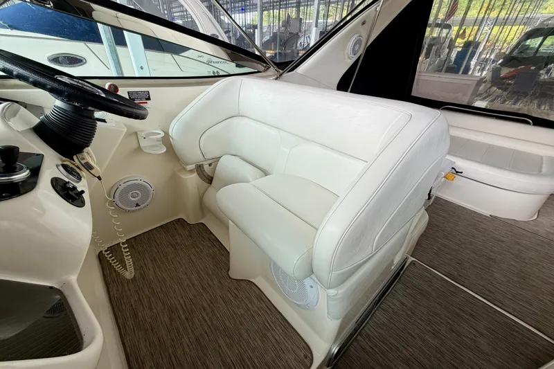 Slide: The Image of 1999 Wellcraft 45 Excalibur interior with white leather seating and steering wheel. - 17