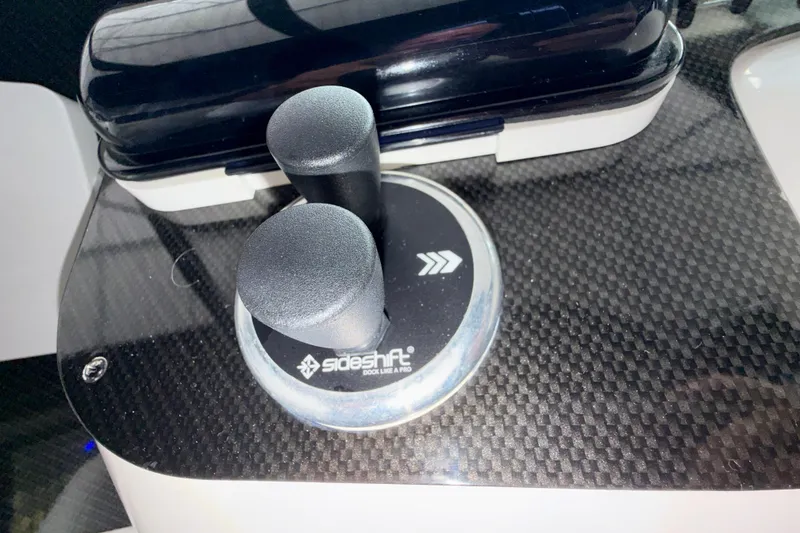 Slide: The Image of 1999 Wellcraft 45 Excalibur boat controls and dashboard with throttle levers. - 22