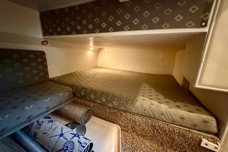 Slide: The Image of Electrical control panel of a 1999 Wellcraft 45 Excalibur boat, featuring various switches and meters. - 39