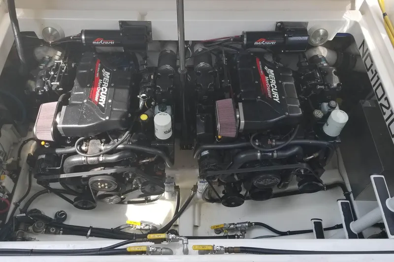 Slide: The Image of 1999 Wellcraft 45 Excalibur cabin interior with patterned bedding and cozy lighting. - 41