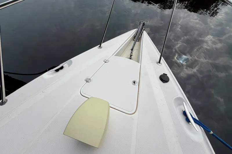 Slide: The Image of Anchor compartment of a 1999 Wellcraft 45 Excalibur boat, open with visible chain. - 6