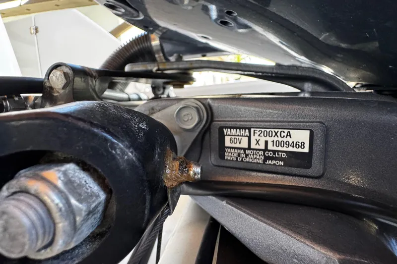 Slide: The Image of Close-up of Yamaha F200XCA engine on 2019 Robalo R272 Center Console boat. - 14