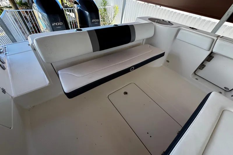 Slide: The Image of 2019 Robalo R272 Center Console boat interior with seating and dual Yamaha 200 engines. - 22
