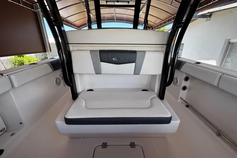 Slide: The Image of 2019 Robalo R272 Center Console boat interior with cushioned seating and sleek design. - 25