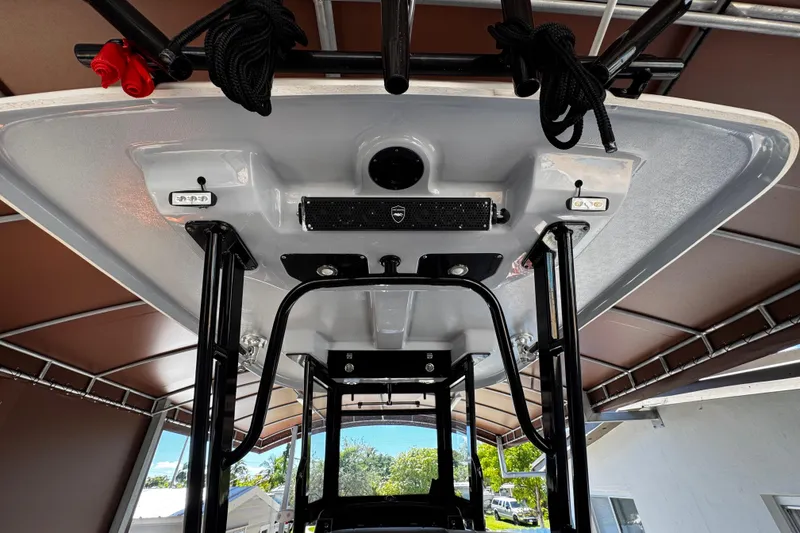 Slide: The Image of 2019 Robalo R272 Center Console boat's T-top with mounted equipment and ropes. - 26
