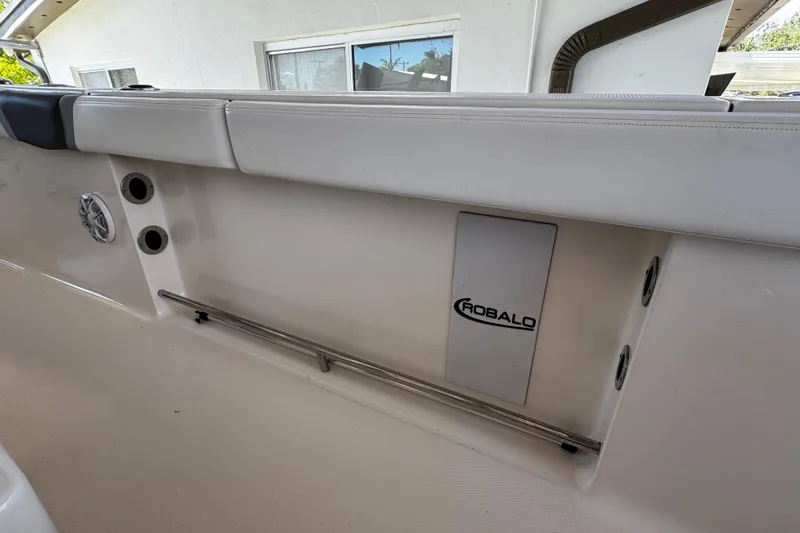 Slide: The Image of 2019 Robalo R272 Center Console interior detail with logo and speaker. - 27