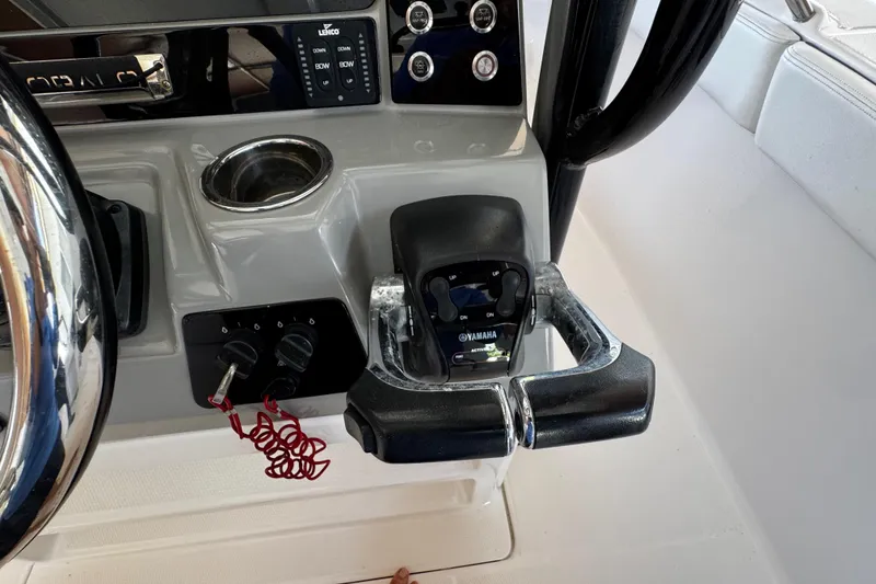 Slide: The Image of 2019 Robalo R272 Center Console boat controls with Yamaha throttle and steering wheel. - 34