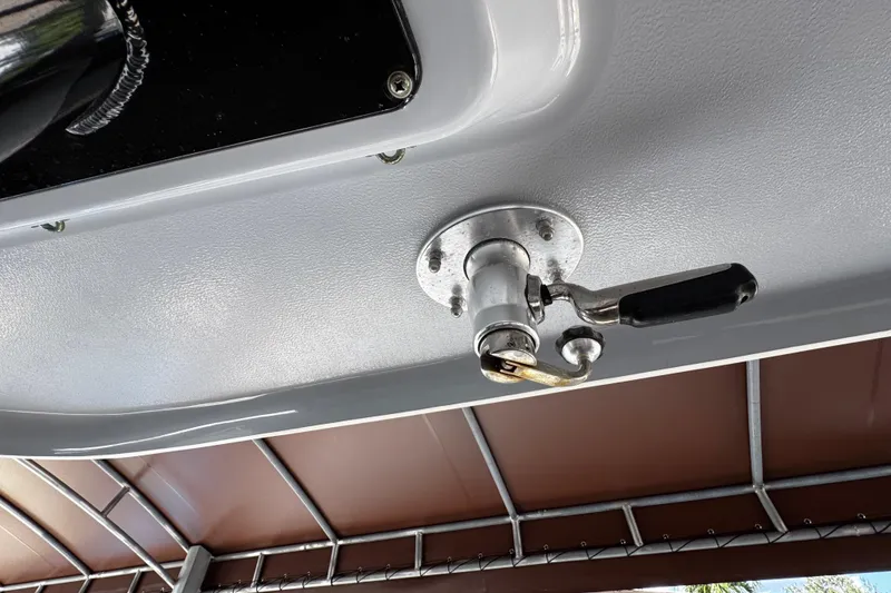 Slide: The Image of 2019 Robalo R272 Center Console boat detail, featuring a mounted handle mechanism. - 42