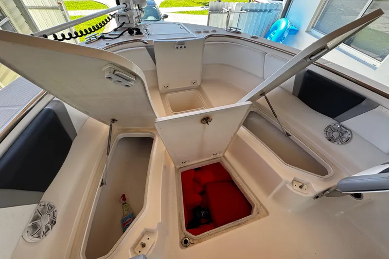 Slide: The Image of 2019 Robalo R272 Center Console boat with open storage compartments. - 44