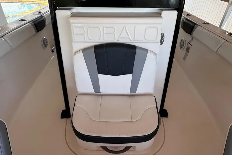 Slide: The Image of 2019 Robalo R272 Center Console boat seat with logo, featuring sleek design and comfortable padding. - 45