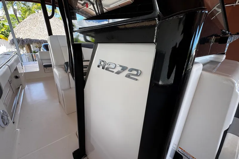 Slide: The Image of 2019 Robalo R272 Center Console interior with sleek design and comfortable seating. - 47