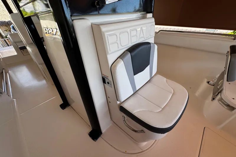 Slide: The Image of 2019 Robalo R272 Center Console boat seat with sleek design and comfortable padding. - 48