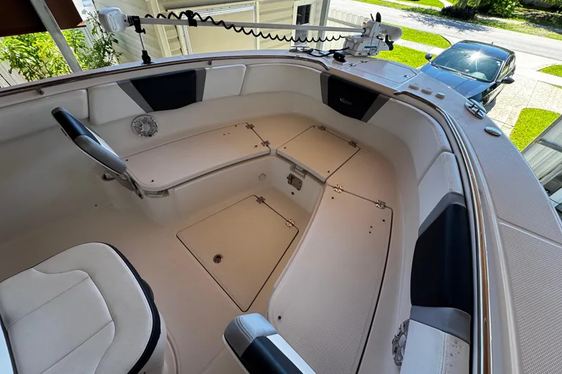 Slide: The Image of 2019 Robalo R272 Center Console boat interior with seating and storage compartments. - 52