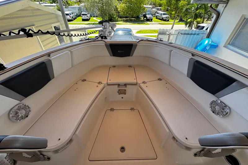 Slide: The Image of 2019 Robalo R272 Center Console boat interior with seating and storage compartments. - 53