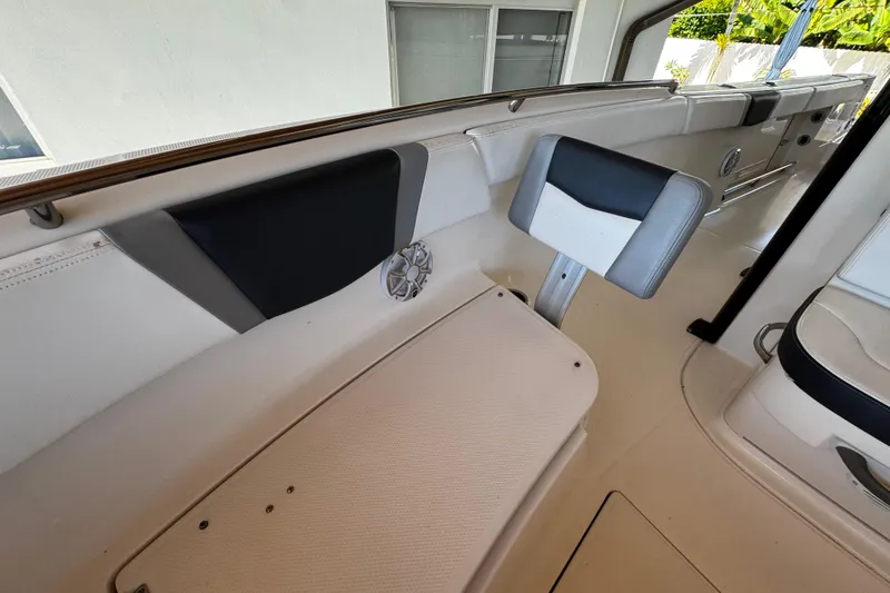 Slide: The Image of 2019 Robalo R272 Center Console boat interior with seating and speaker. - 56