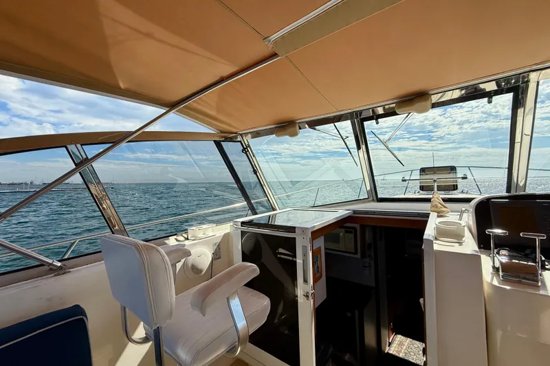 Slide: The Image of Interior view of 1999 Legacy 40 boat cockpit with ocean backdrop. - 40