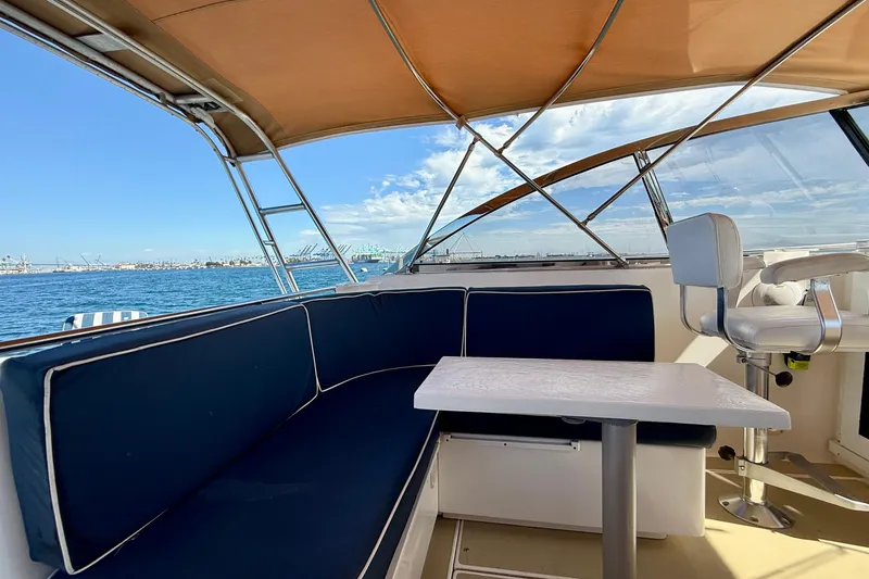 Slide: The Image of Interior of 1999 Legacy 40 yacht with blue seating and ocean view. - 41