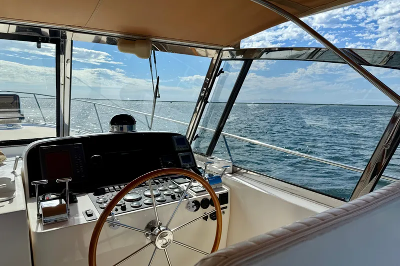 Slide: The Image of Helm of 1999 Legacy 40 yacht with ocean view and clear sky. - 46