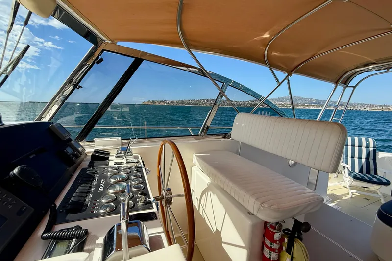 Slide: The Image of Interior view of 1999 Legacy 40 yacht helm with ocean backdrop. - 52