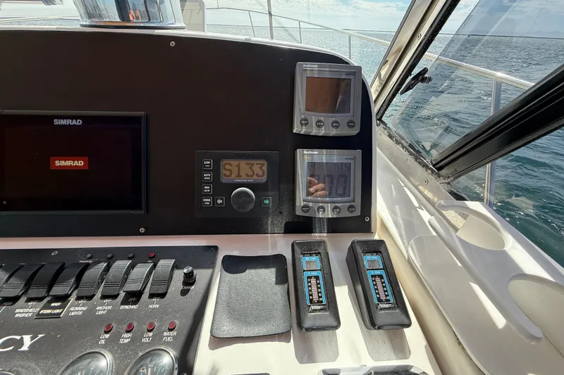 Slide: The Image of Control panel of a 1999 Legacy 40 boat with Simrad navigation system. - 56