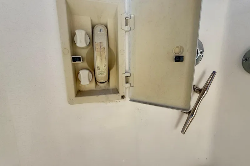 Slide: The Image of Electrical panel with switches and handle on a Legacy 40, 1999 model. - 62