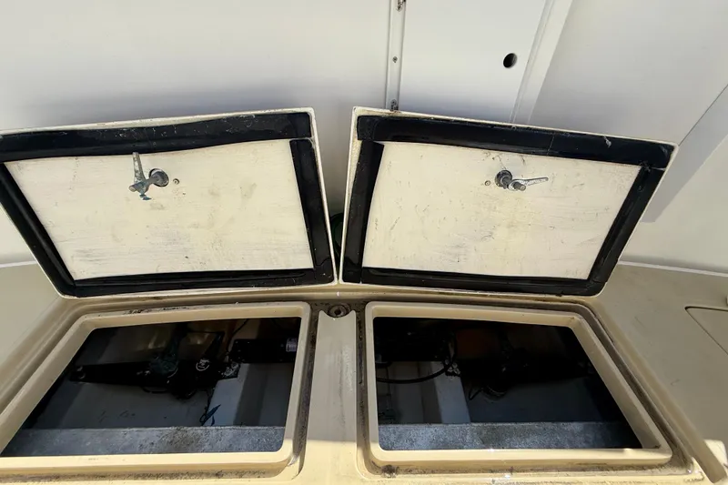 Slide: The Image of Open storage compartments on a 1999 Legacy 40 boat, showcasing interior details. - 64