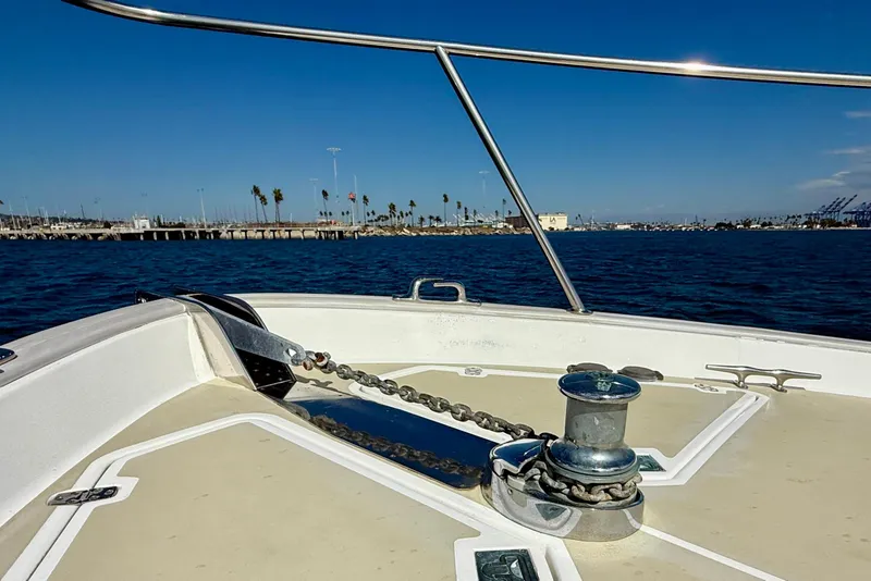 Slide: The Image of Bow of 1999 Legacy 40 boat with anchor chain, ocean view, and clear blue sky. - 71