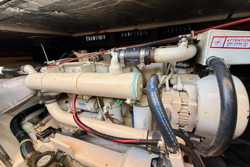 Slide: The Image of Engine compartment of a 1999 Legacy 40 boat, showcasing detailed mechanical components. - 81