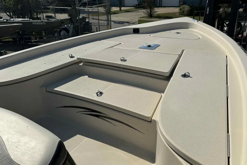 Slide: The Image of 2014 Blue Wave 2000 PureBay boat deck with storage compartments and sleek design. - 12
