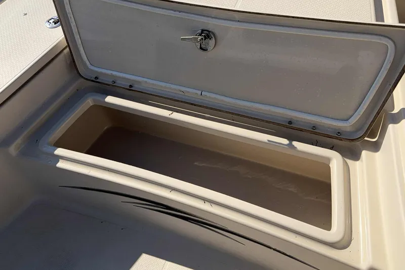 Slide: The Image of Open storage compartment on 2014 Blue Wave 2000 PureBay boat. - 13