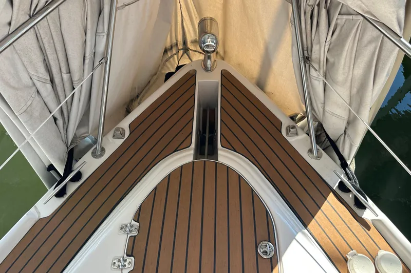 Slide: The Image of 2006 Four Winns 378 Vista yacht docked in a covered marina. - 11